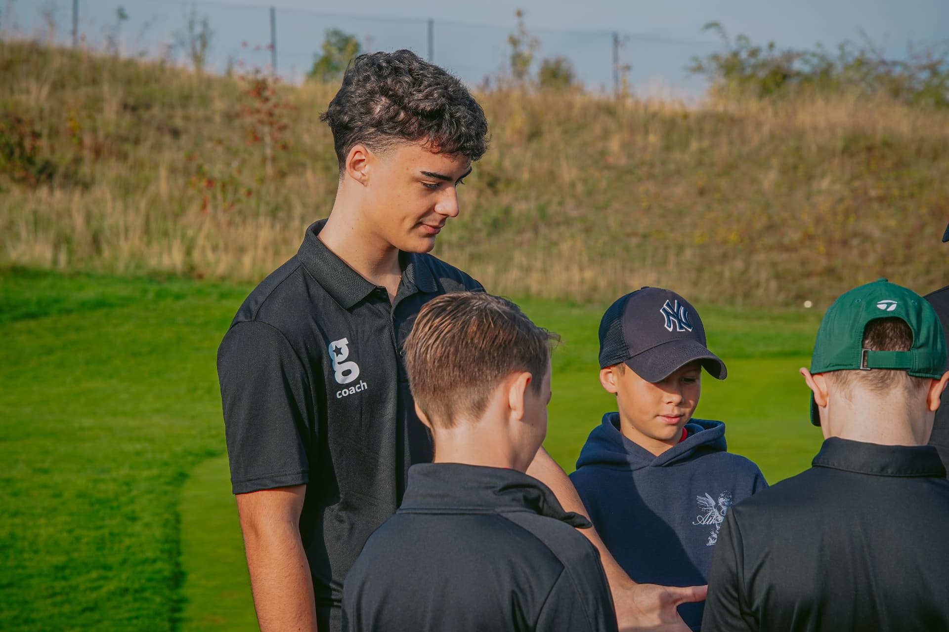 A former junior, now a golfstars coach, working with young players