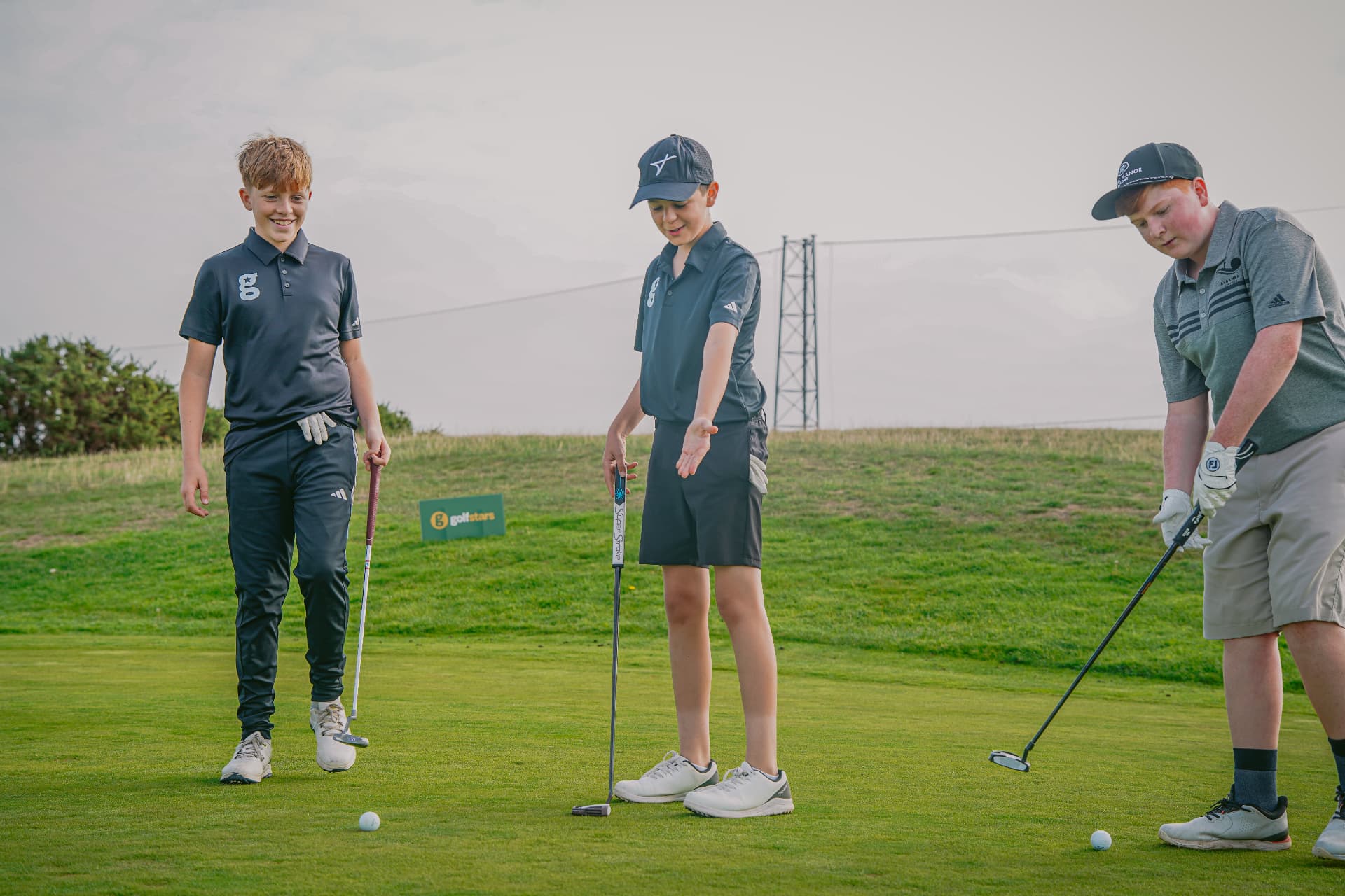 Young golfers together at a Golfstars camp
