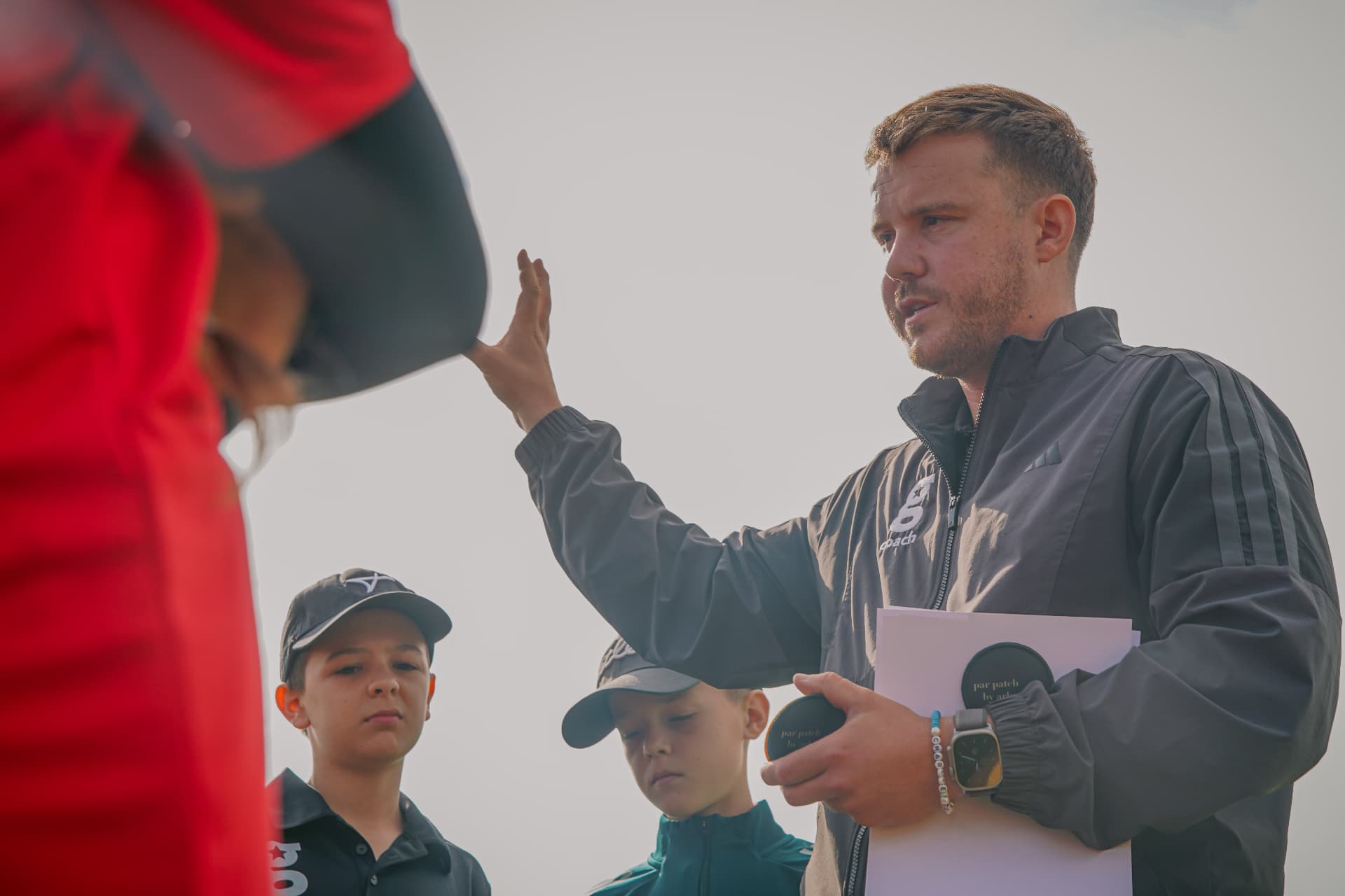 PGA Professional coaching a group of young golfers at a golfstars venue